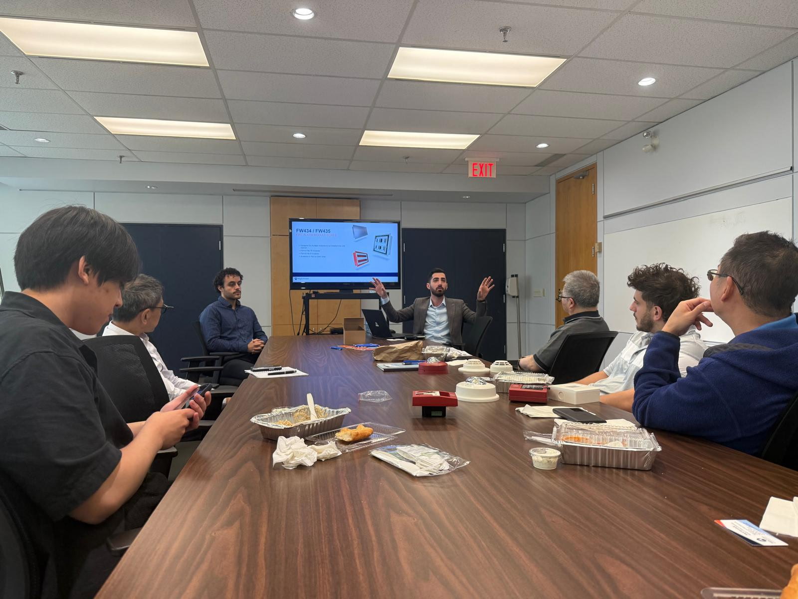 Picture of Maple Armor employees conducting a lunch and learn presentation to an engineer firm